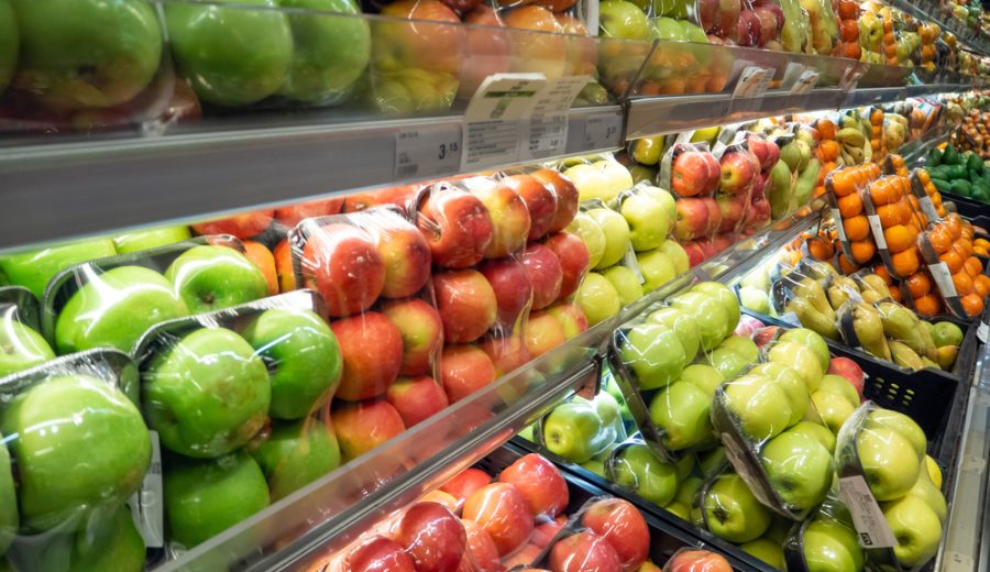 packages of fresh seasonal fruit on supermarket shelf